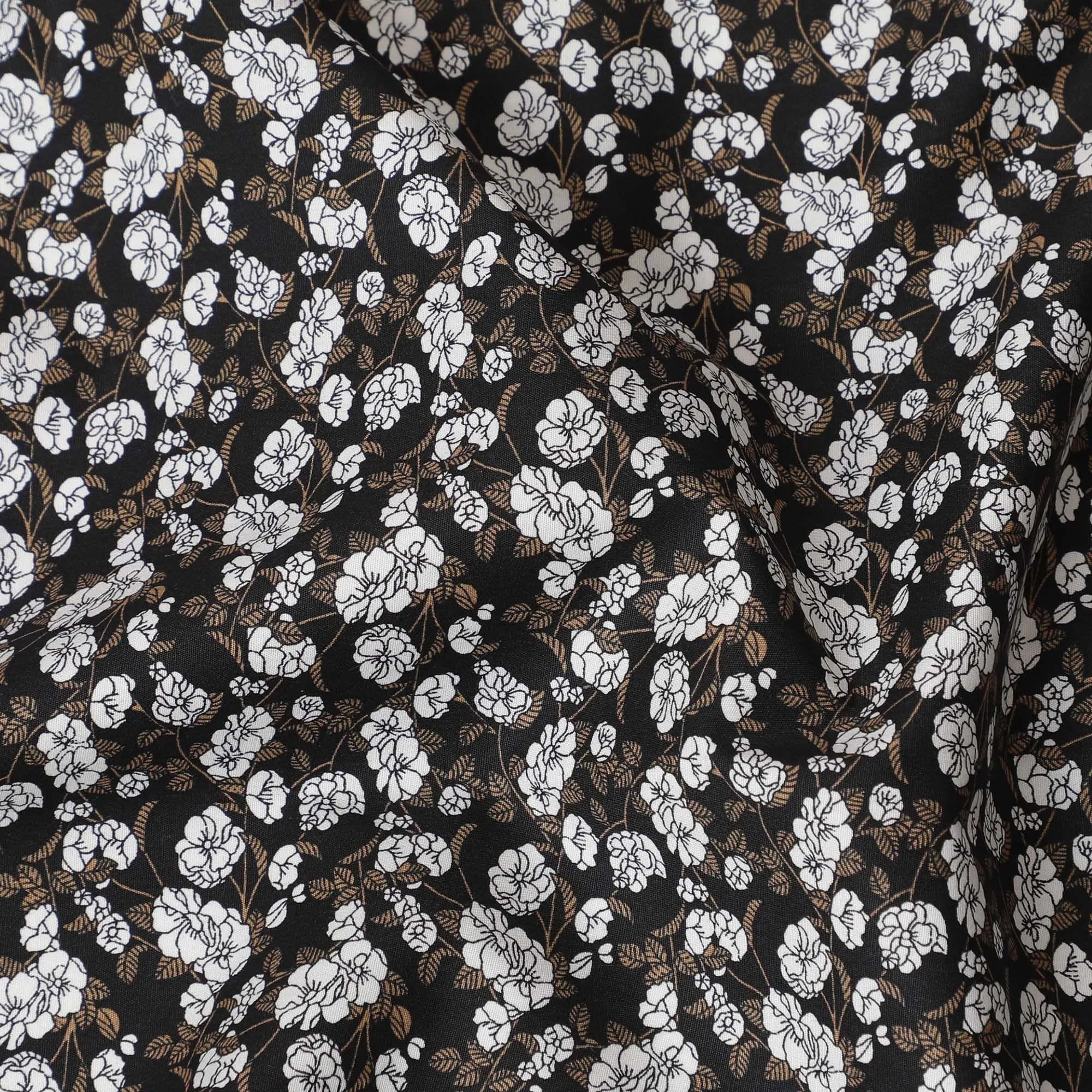 Black cotton fabric with white and meindi green print in floral design-D14842